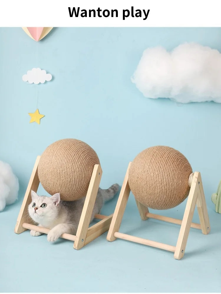 A cat is playing with a beige sisal rope ball toy resting on a wooden base against a light blue background.