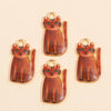A set of four small, round pendant charms shaped like orange tabby cats with gold-colored jump rings.