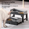 A gray elevated dog feeder with two stainless steel bowls is shown next to a dog.