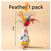 A feather toy in the shape of a baby's head with a wooden body and colorful feathers.