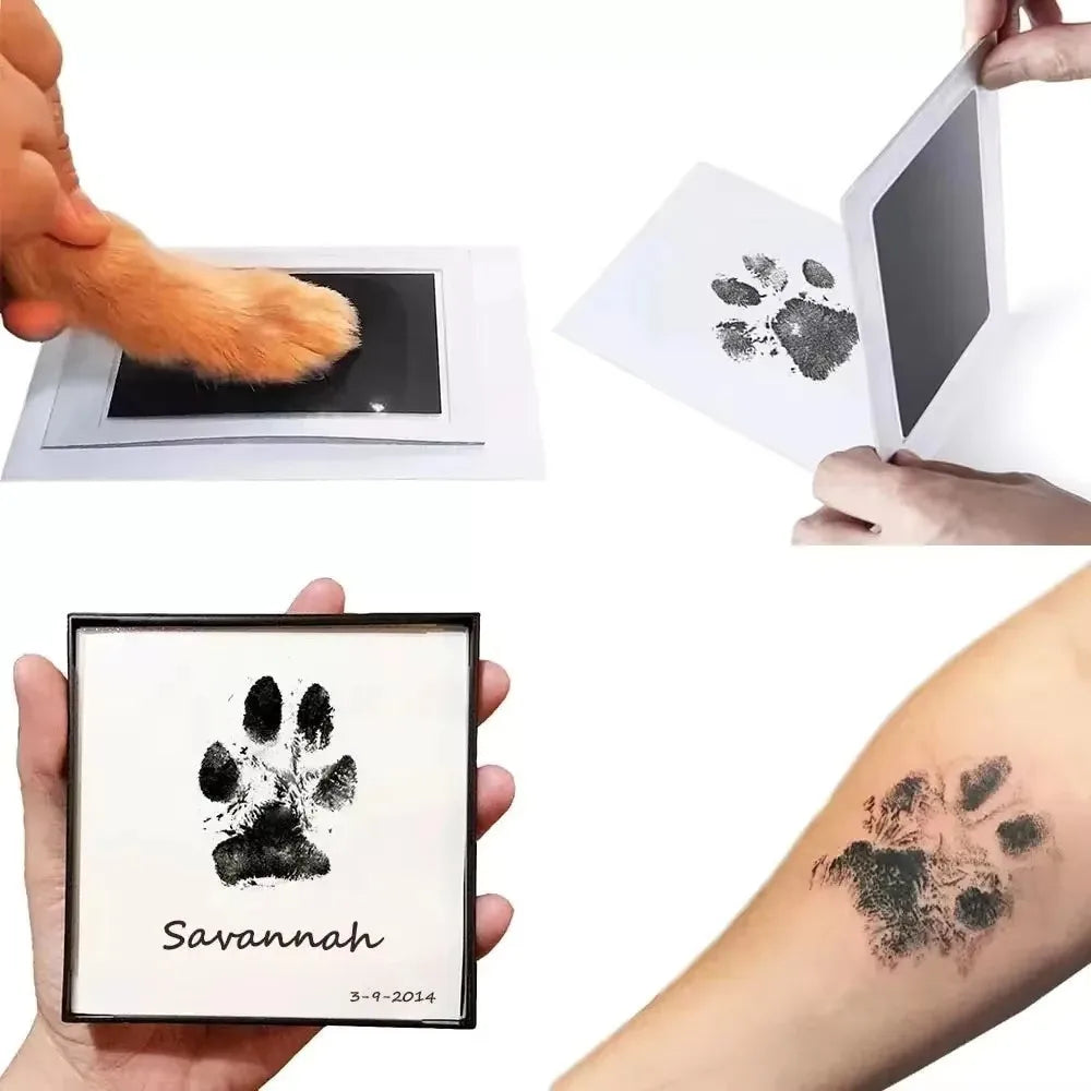A hand holds a black paw print keepsake kit with the name Savannah and a paw print tattoo on an arm.