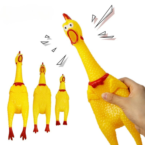 A yellow squeaky rubber chicken dog toy being held, with several similar toys visible.