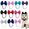 A collection of 30 handmade dog hair bow sets in various colors including blue, pink, purple, and black.
