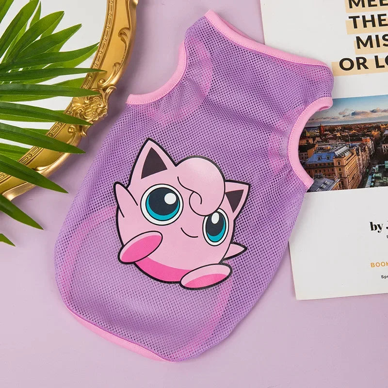 A pink breathable mesh pet vest with a cute cartoon character print lying on a purple surface.