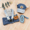 A blue and white checkered dog harness vest with a bear-themed fabric and attached leash.