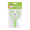 A clear plastic package containing a green garbage bag holder for a dog's poop bag.