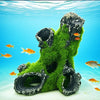 A resin aquarium tree house cave structure covered in green moss and rocks, submerged underwater.