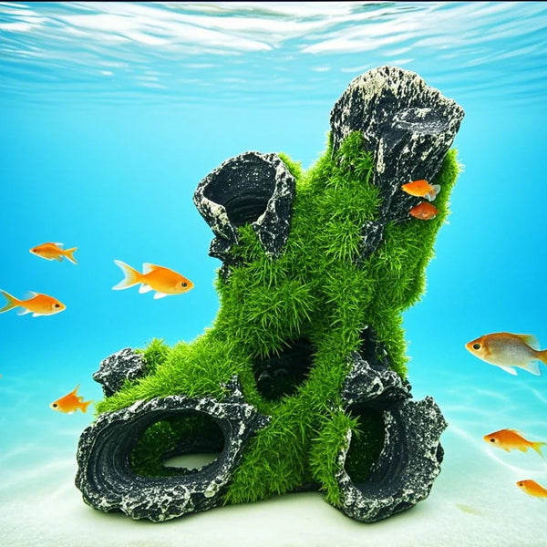 A resin aquarium tree house cave structure covered in green moss and rocks, submerged underwater.