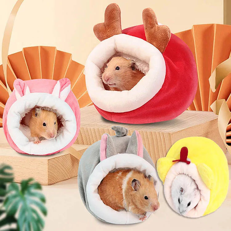 Several plush sleeping nests for hamsters in pink, red, and yellow colors.