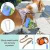 A dog wearing a purple harness with a blue silicone poop bag dispenser and storage holder attached.