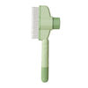 A light green pet hair remover brush with a comb attachment.
