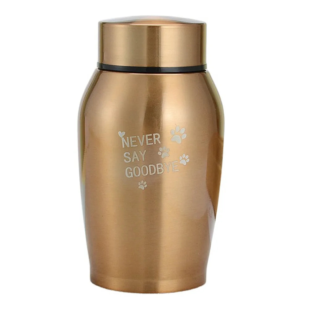 A gold-toned stainless steel pet memorial storage box with the words Never Say Goodbye engraved on the side.