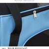 Close-up of a blue fabric flap on a black pet carrier bag showing a silver zipper and strap details.