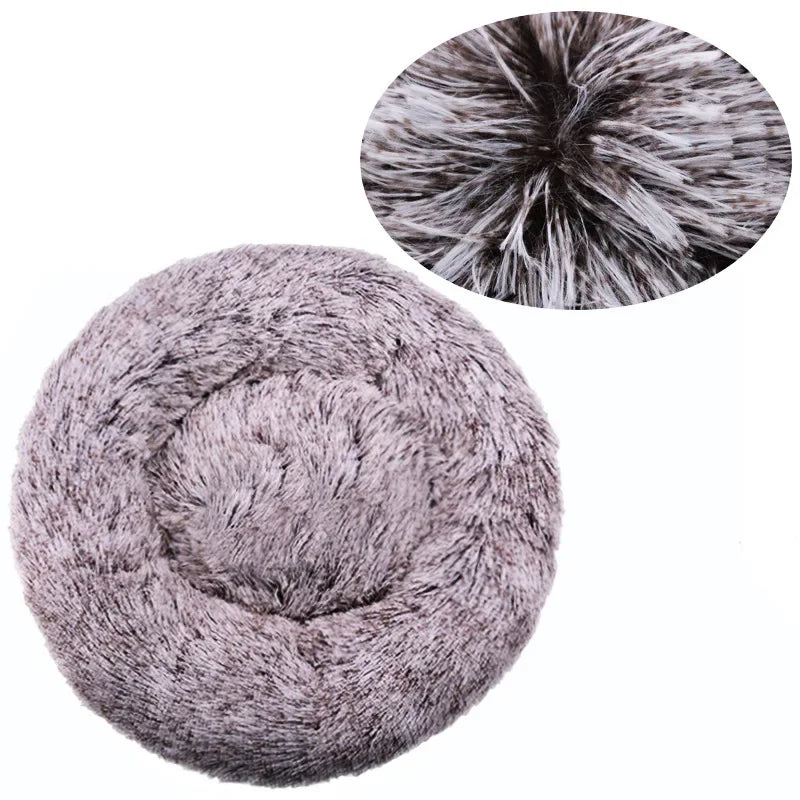 A round, gray ultra-soft plush pet bed for dogs and cats with a zoomed-in view of its fluffy texture.