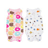 A set of pink and white comfortable recovery vests for cats featuring various colorful patterns and small animal designs.
