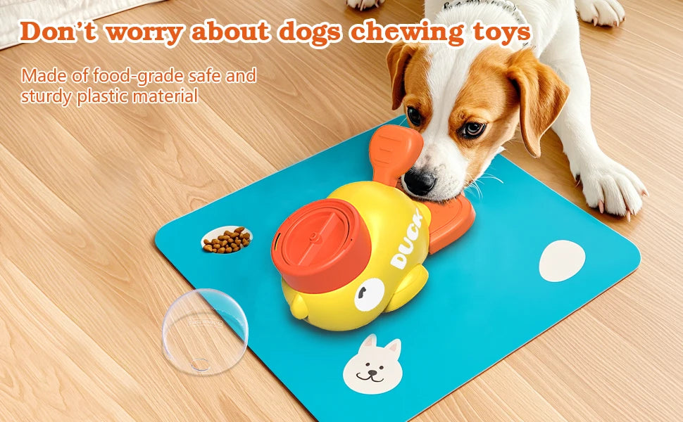 A yellow and orange interactive treat dispenser toy for dogs placed on a blue mat next to a dog.