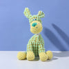 A light green squeaky plush toy shaped like a donkey dog with textured teeth