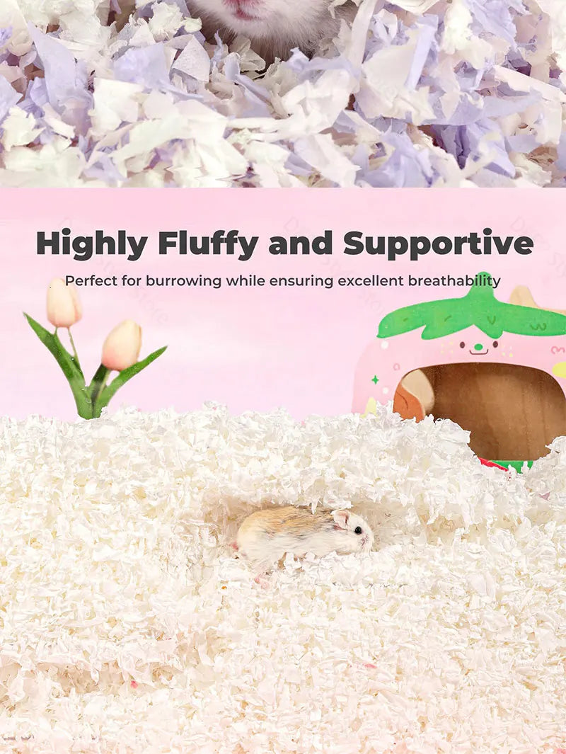 Flauschiges weißes Papierbettwäsche mit einem kleinen Hamster, der sich im weichen Material begräbt.