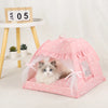 A pink cozy pet tent bed for cats with a mesh enclosure and a fluffy gray kitten inside.