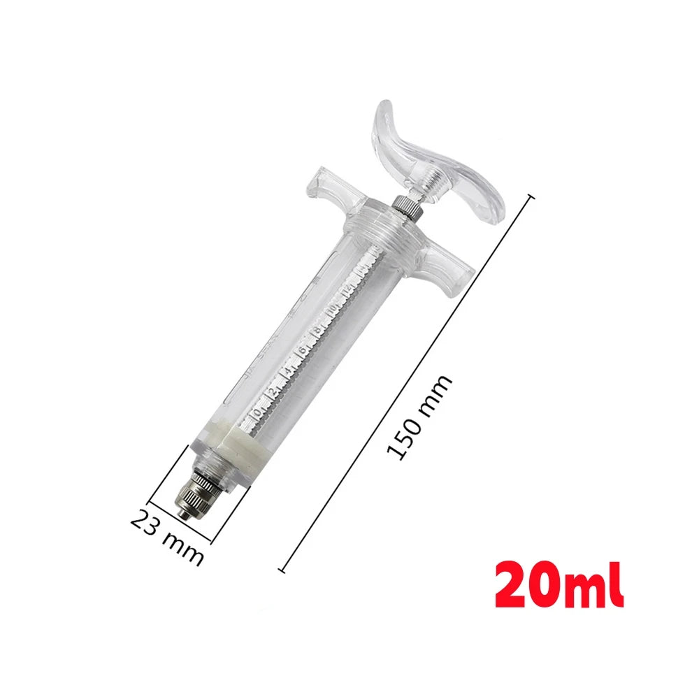 A clear plastic syringe with a metal tip and markings, used for feeding small animals.