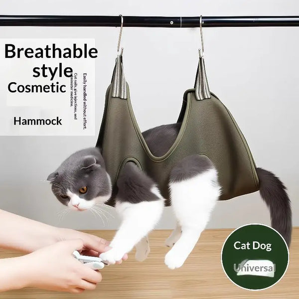 A gray and white cat is shown using a pet grooming hammock for nail clipping and daily care.