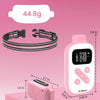 A pink dog training collar with a remote, showing its size and features.