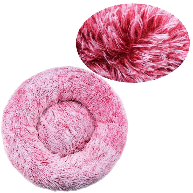 A close-up view of a pink, fluffy pet bed for dogs and cats, showing its soft texture.