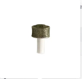 A small, round, glittery green pet nail grinder with a white base.