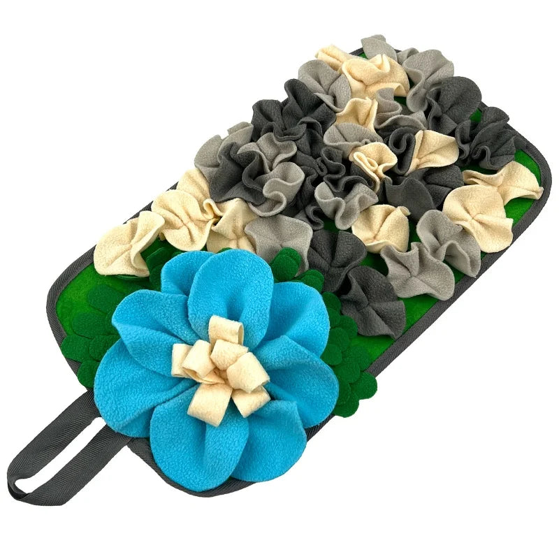 Interactive pet foraging mat featuring various fabric flowers in shades of green, gray, and beige.