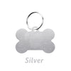 Silver bone-shaped dog ID tag with a circular loop for attachment