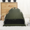 A dark olive green cozy pet tent bed for cats resting on a white fluffy surface.