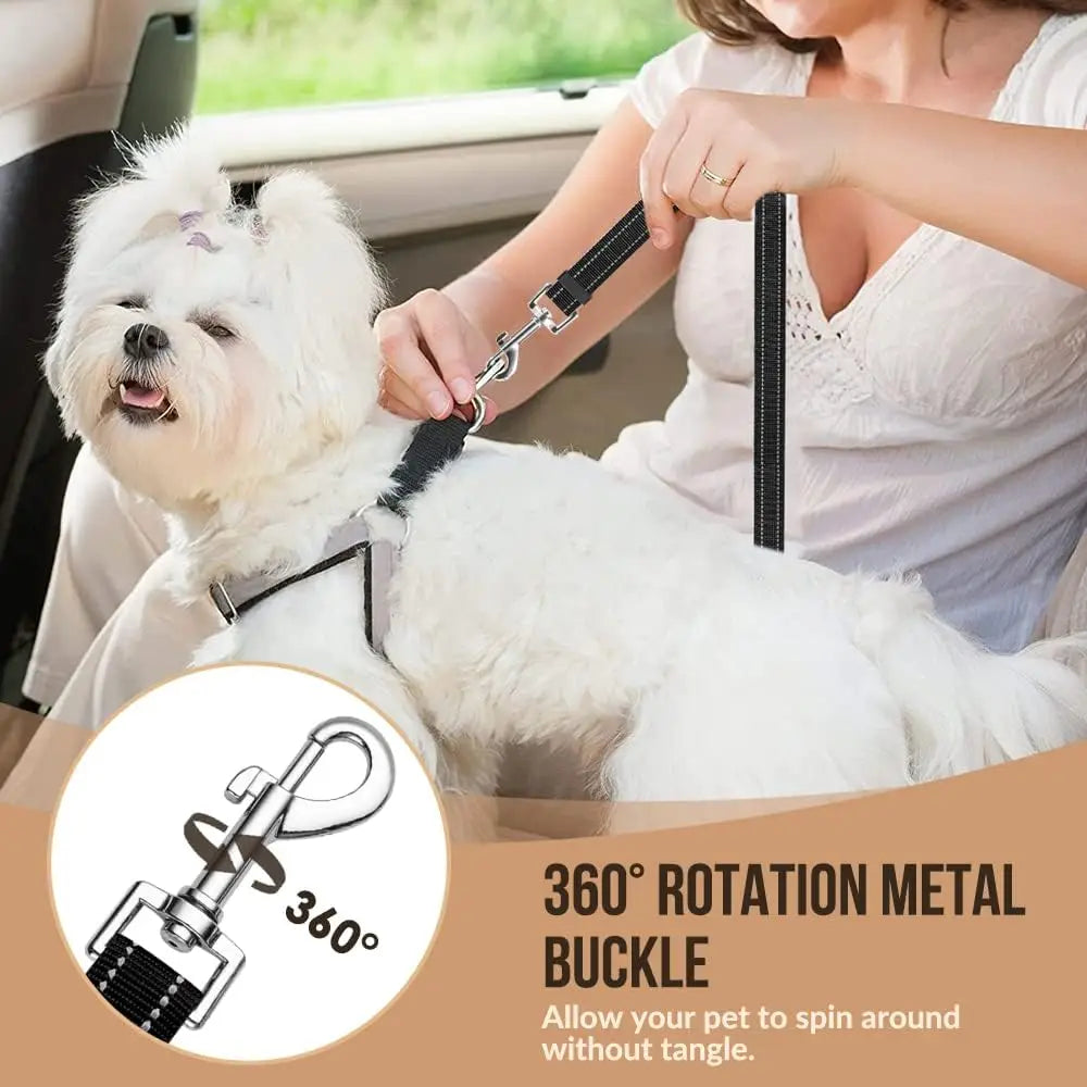 A woman is holding an adjustable dog car seat belt with a 360 degree rotation metal buckle on a white dog.