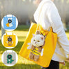 A yellow portable crossbody pet carrier bag featuring a stuffed cat toy, shown being carried by a person outdoors.
