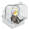 Clear plastic external bird bath designed for cages and parakeets, featuring a small yellow and gray bird.