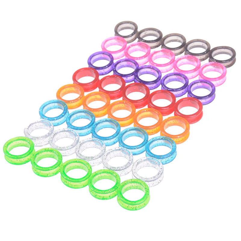 A collection of colorful silica gel hair scissors in various shades of pink, purple, orange, blue, and green.