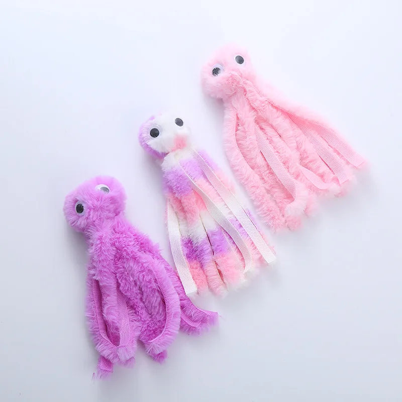 Three fluffy pink and purple octopus plush toys for cats and dogs