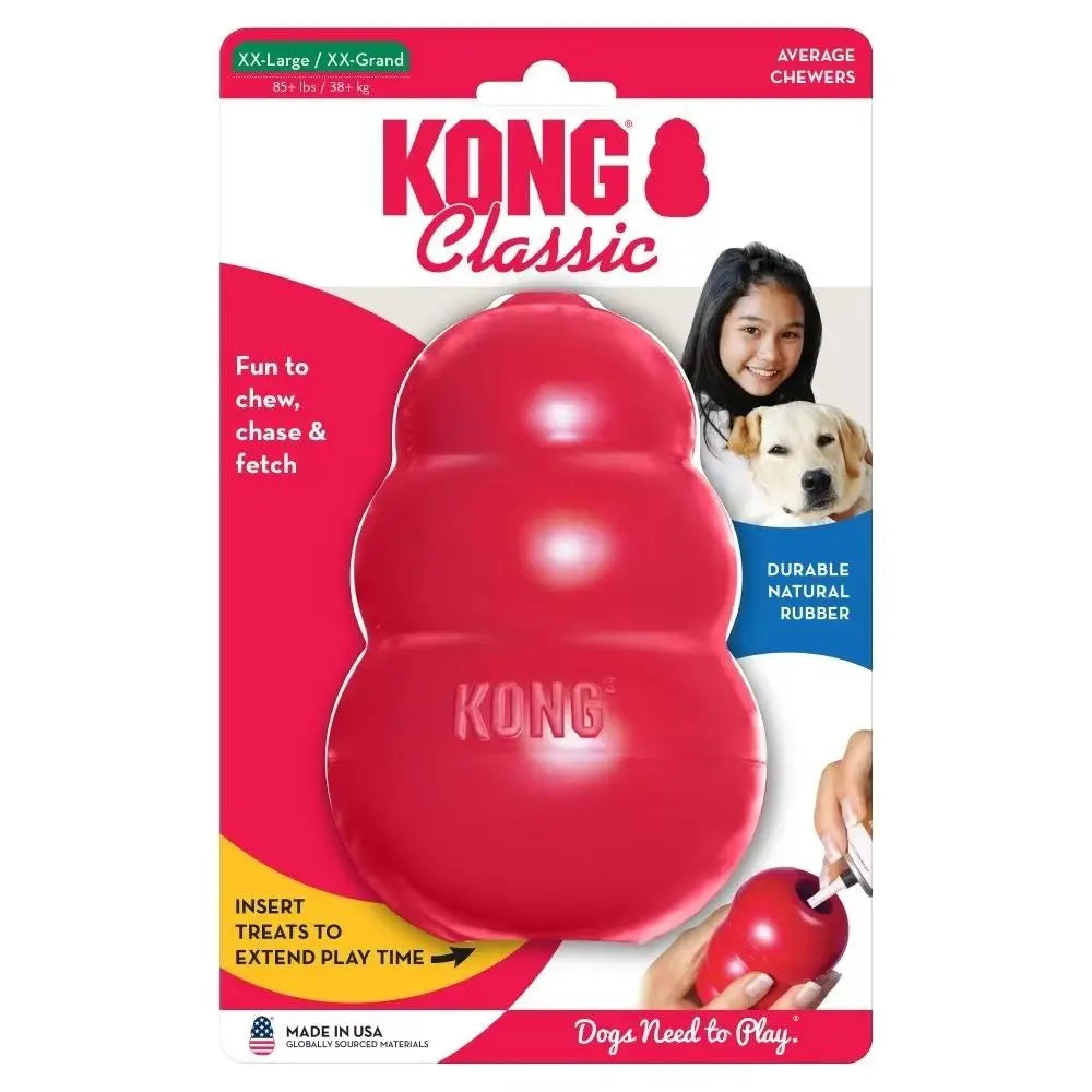 A red Kong Classic dog chew toy with a treat dispensing core shown in packaging.