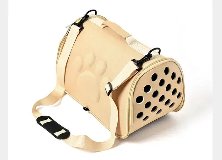 A beige breathable pet carrier bag designed for cats and small dogs, shown from the side.