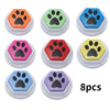 Eight colorful recordable talking buttons for dog training featuring paw print designs.