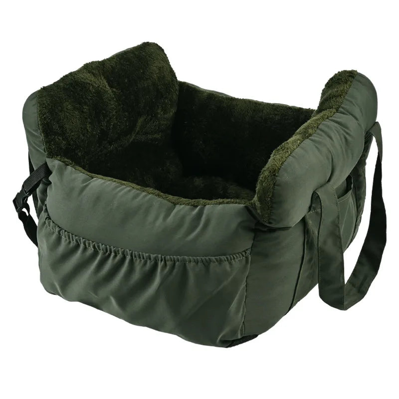 A dark olive green durable pet car seat with a plush, dark green faux fur lining and safety straps.