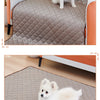 A fluffy white dog is lying on a beige quilted washable cooling mat for dogs.