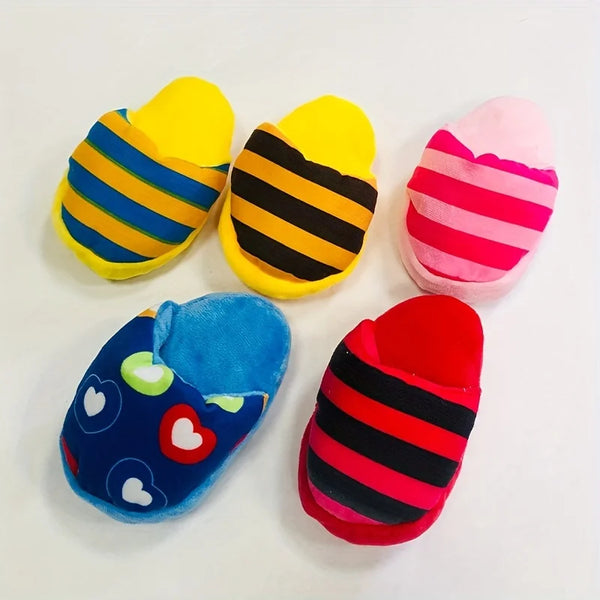 A collection of colorful plush dog chew toys including yellow, pink, and blue slippers.