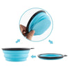 A hand is shown holding a light blue silicone pet travel bowl, with the bowl and its lid displayed separately.