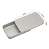 A silver compact sliding lid tin box with dimensions 6cm by 3.4cm and 1.1cm thick.