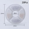 A circular white filter disk with four internal compartments for replacement activated carbon filters.