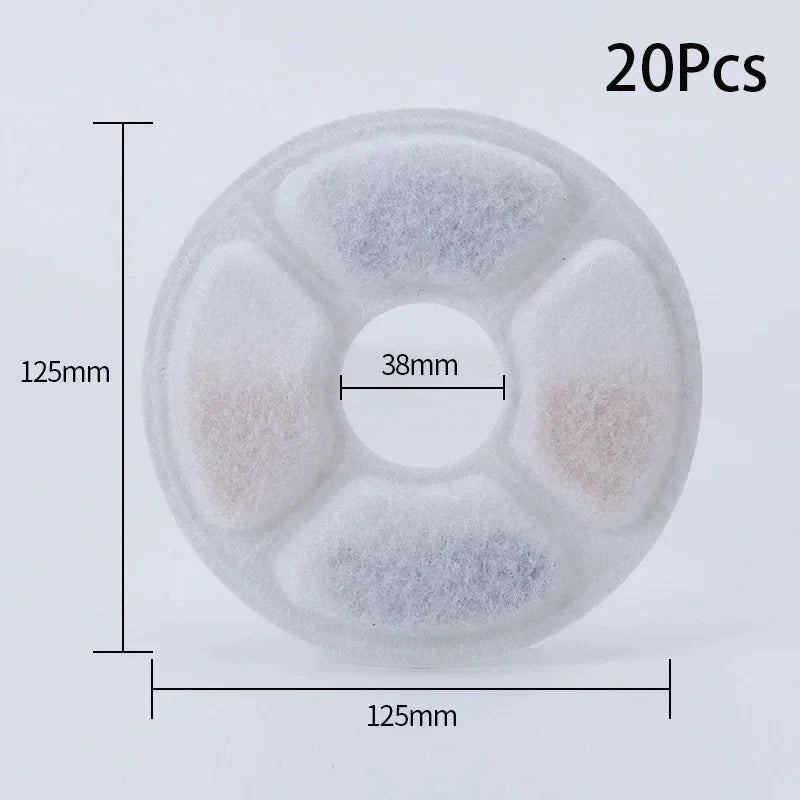 A circular white filter disk with four internal compartments for replacement activated carbon filters.