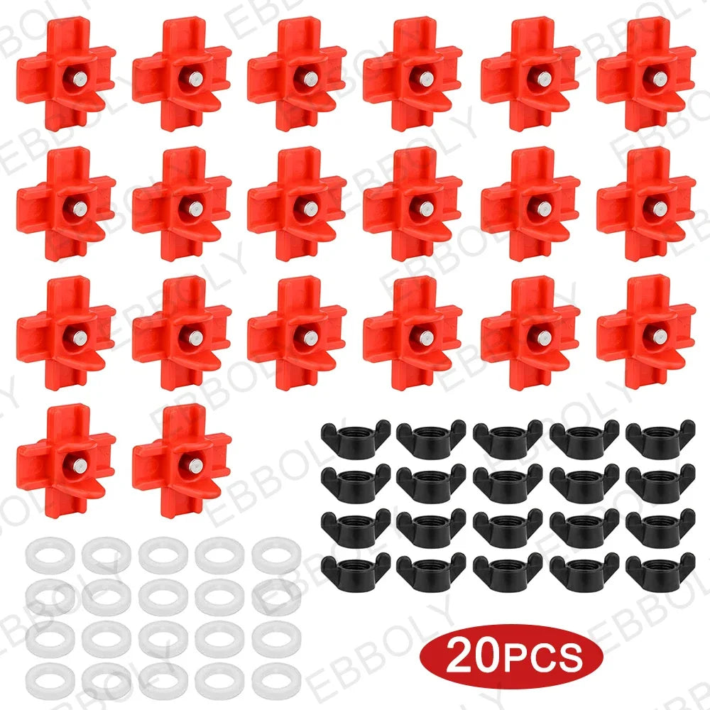 Un jeu de tétines et anneaux rouges en plastique pour abreuvoirs automatiques à volailles.