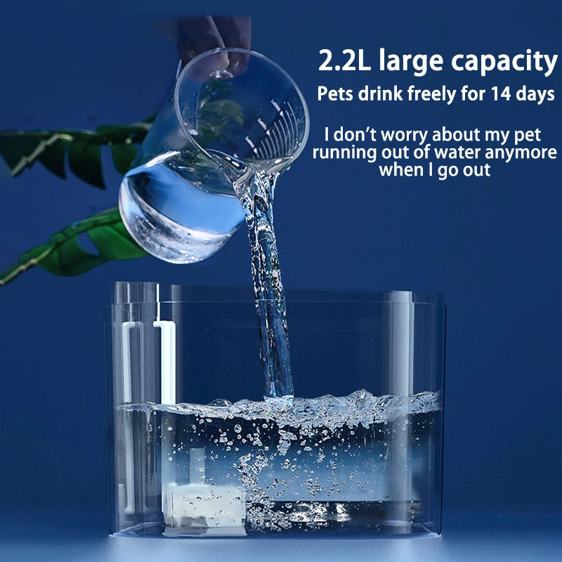 A clear water fountain is shown pouring water into a glass, with a pet drinking from it.