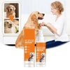 A woman is applying a hot spot and wound spray to a dog, with bottles of the product visible.