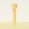 A light yellow long-handled pet food dispensing spoon with a rounded handle and a tapered end.